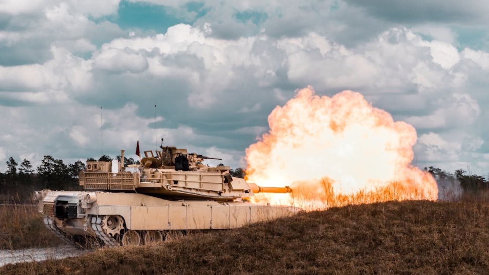 Foam blast mitigation polyurea coating protecting military structure from explosive forces